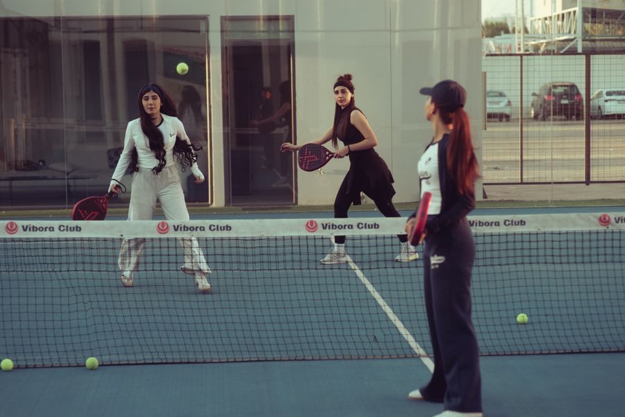 A group of players on court at a padel event