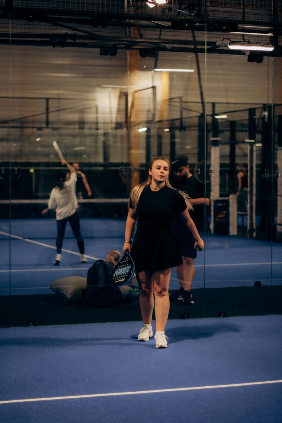 A doubles padel game in play